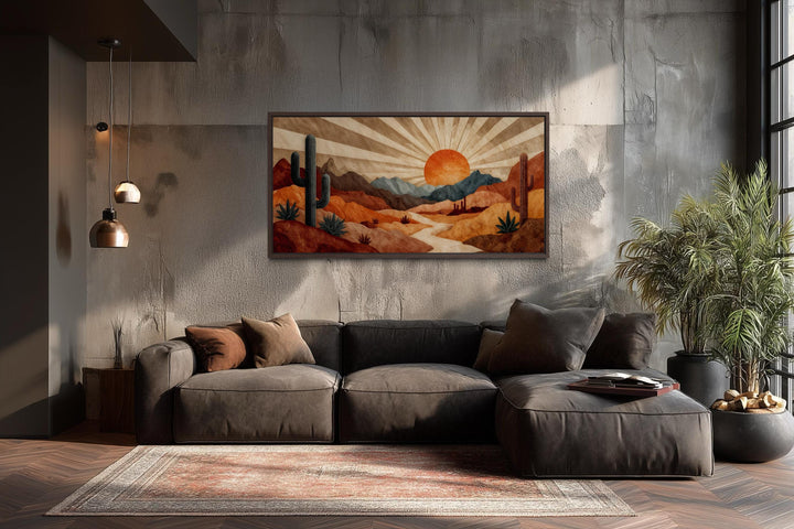 Mid Century Modern desert landscape wall art with a retro sunset in warm earth tones above a sofa.