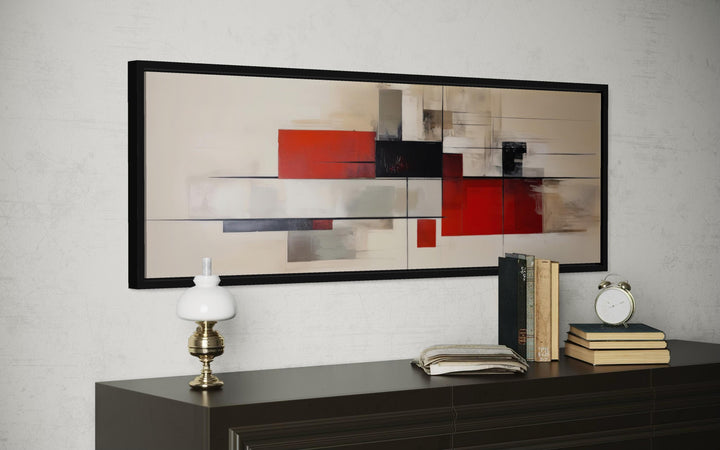 Mid century modern geometric abstract canvas print in red, beige, and black on a dark sideboard.