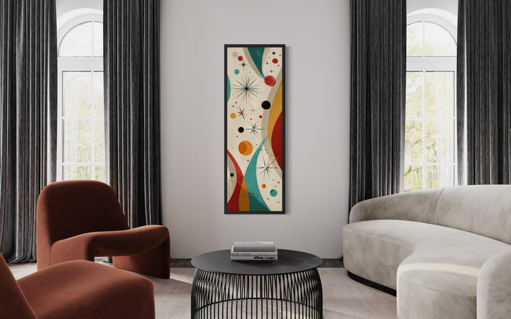 Vertical mid-century modern canvas art with retro geometric shapes and atomic details on a white wall.