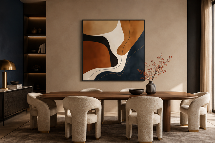 Square abstract canvas art with organic navy, rust, and beige shapes above a modern dining table.