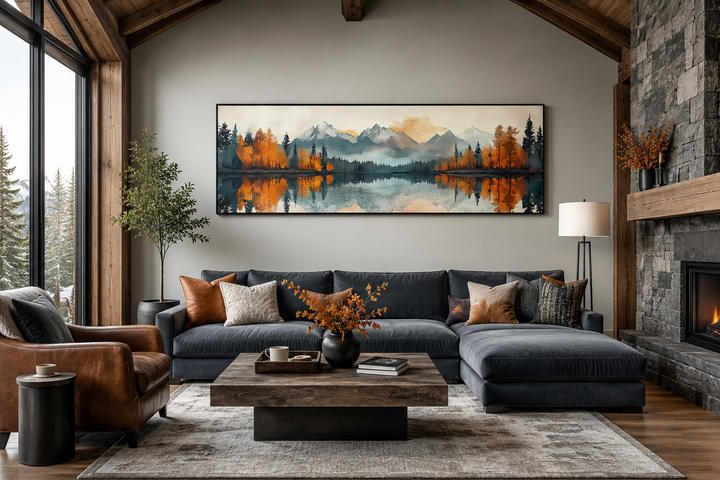 Long narrow mid-century modern lake and mountain landscape wall art hanging above a blue sofa.