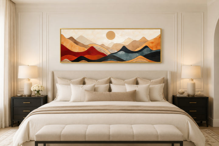 Vintage mid-century modern long horizontal mountain canvas wall art above a bed in a bedroom.