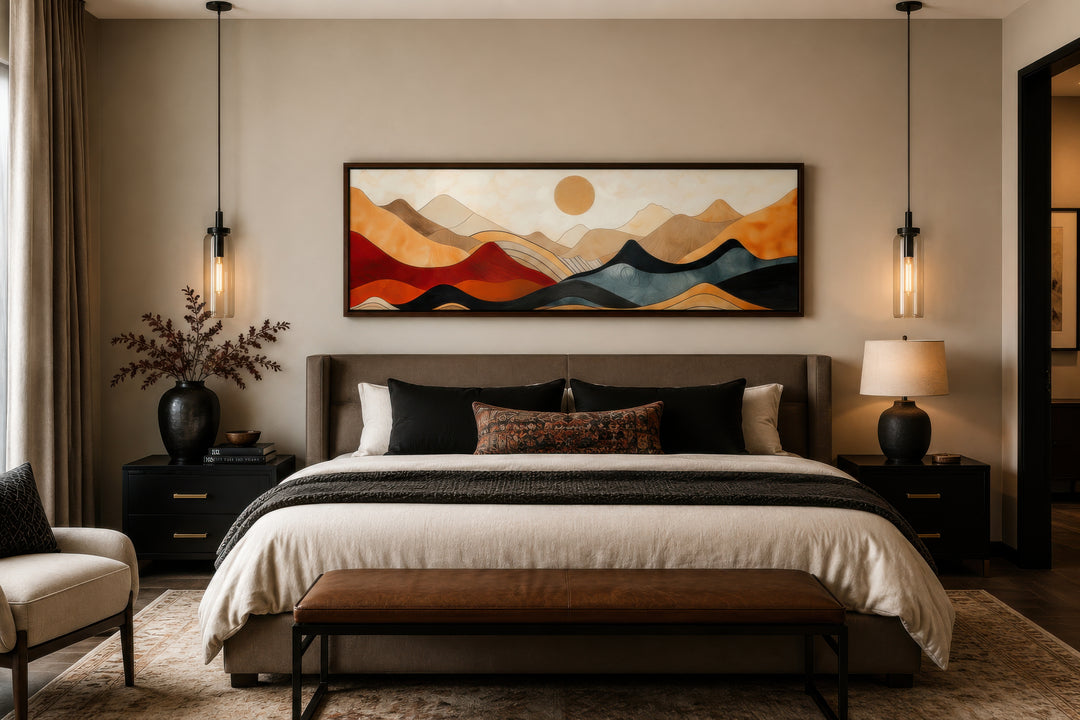 Long horizontal mid-century modern mountain canvas wall art in earthy tones above a bed.