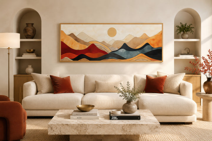 Vintage mid-century modern long horizontal mountain canvas wall art above a cream sofa.