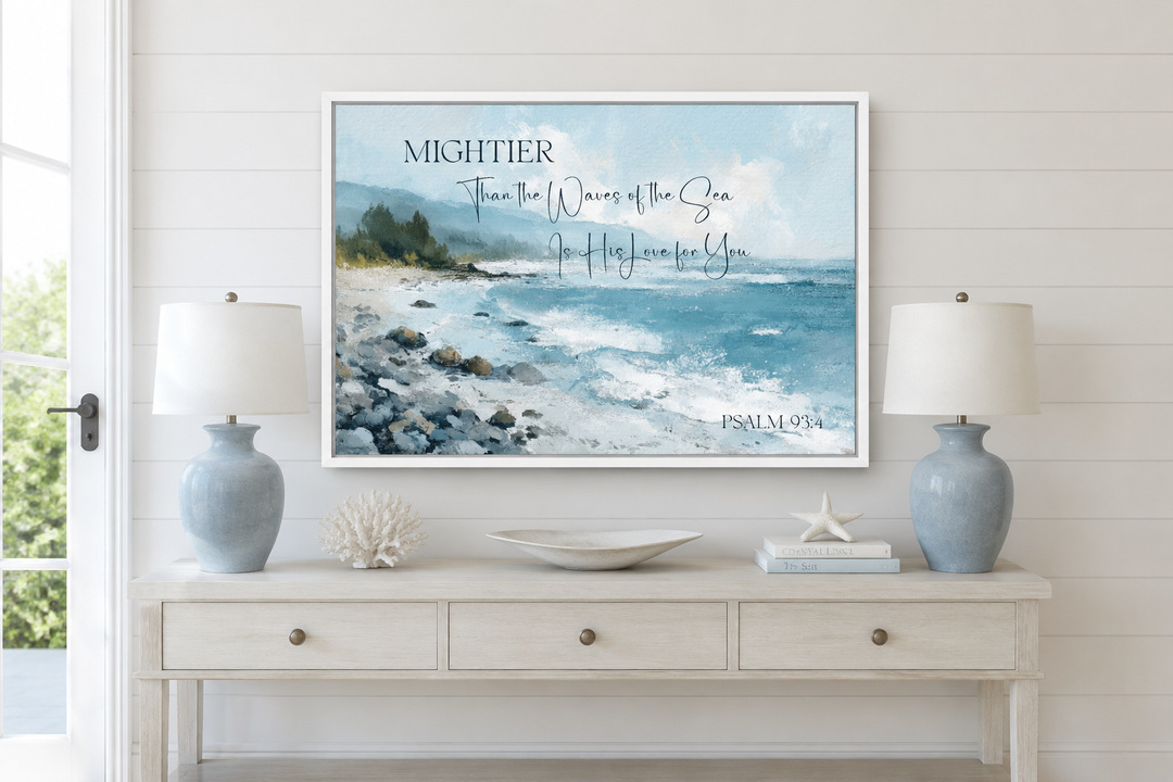 Coastal wall art with Psalm 93:4 scripture over a painted ocean scene on a white console table.