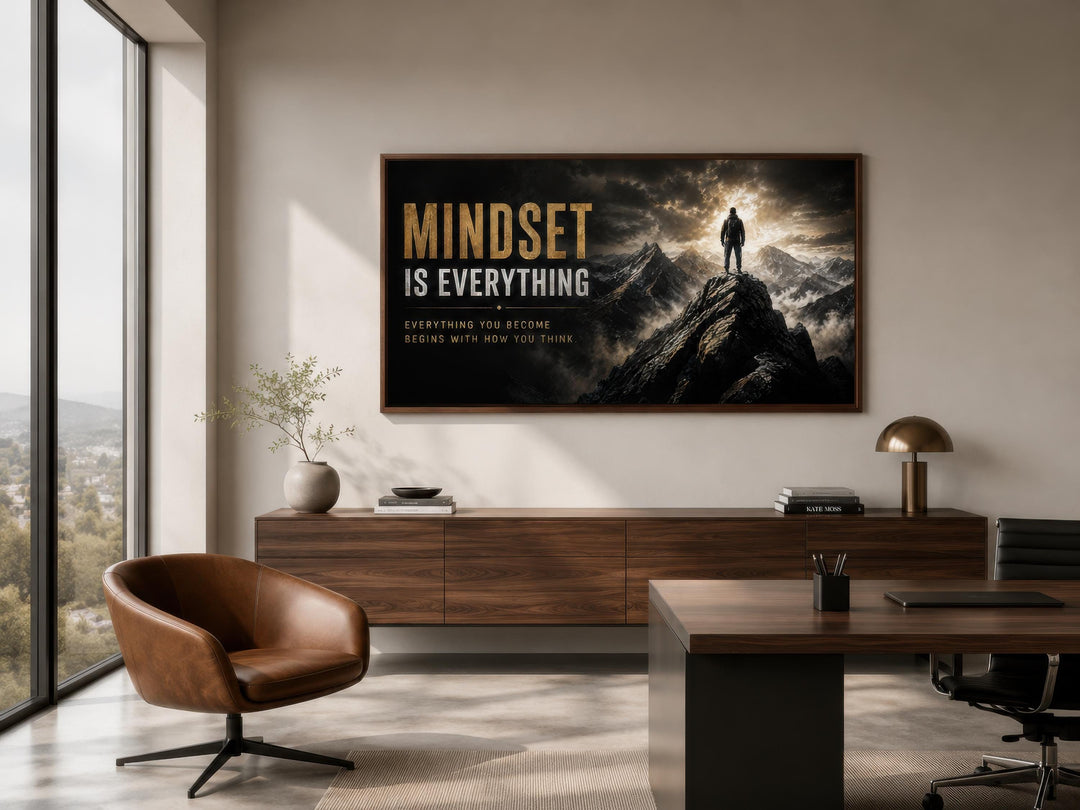 Mindset Is Everything wall art featuring a figure on a mountain peak in a modern office setting.