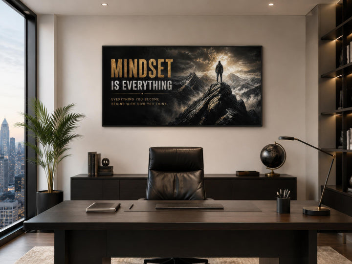 Mindset Is Everything wall art featuring a figure on a mountain peak in a modern office setting.