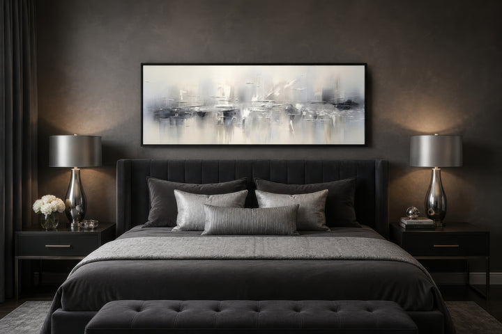 Minimalist abstract silver gray long horizontal framed canvas wall art hanging above a bed.