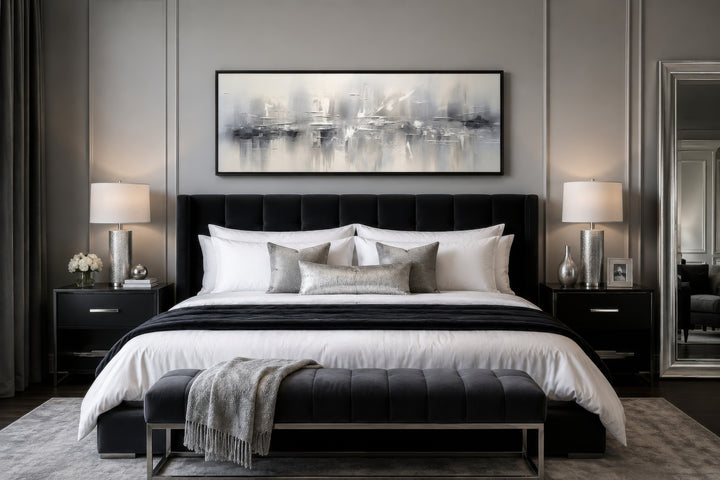 Minimalist abstract silver gray long horizontal framed canvas wall art hanging above a bed.