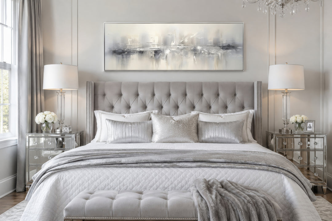 Minimalist abstract silver gray long horizontal framed canvas wall art hanging above a bed.