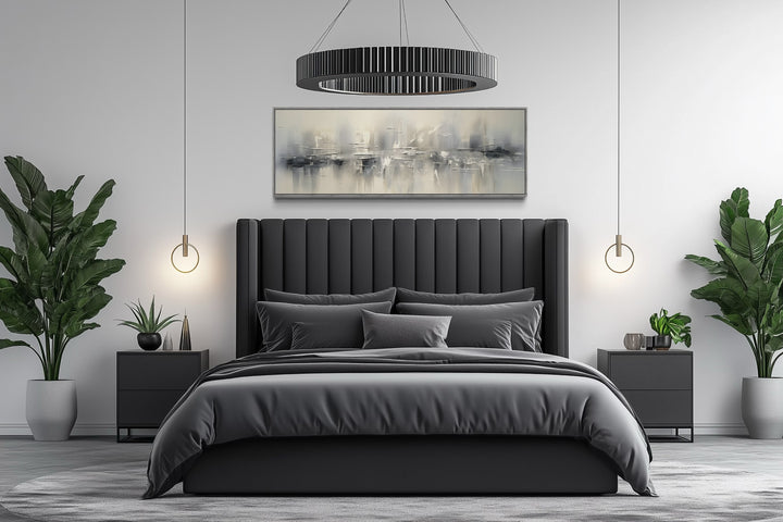 Minimalist abstract silver gray long horizontal framed canvas wall art above a modern bed.