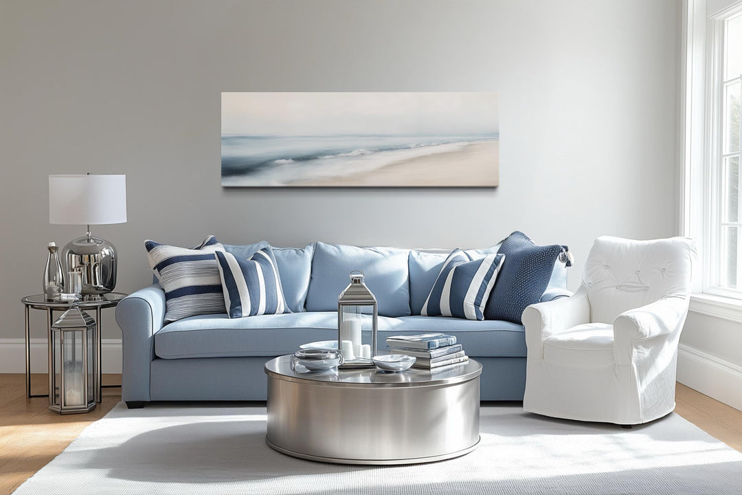 Minimalist panoramic coastal wall art featuring a soft gray and blue watercolor ocean beach scene.