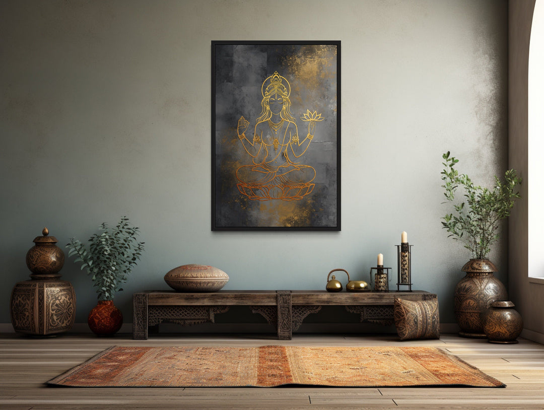 Minimalist Lakshmi gold and silver framed canvas wall art in a serene, culturally inspired room.