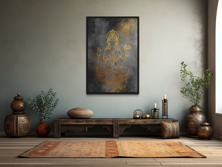 Minimalist Lakshmi gold and silver framed canvas wall art in a serene, culturally inspired room.