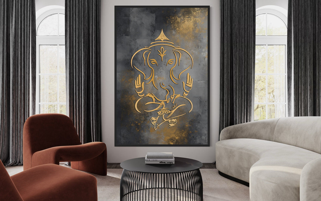 Minimalist gold Lord Ganesha line art on a gray and gold framed canvas in a modern living room.