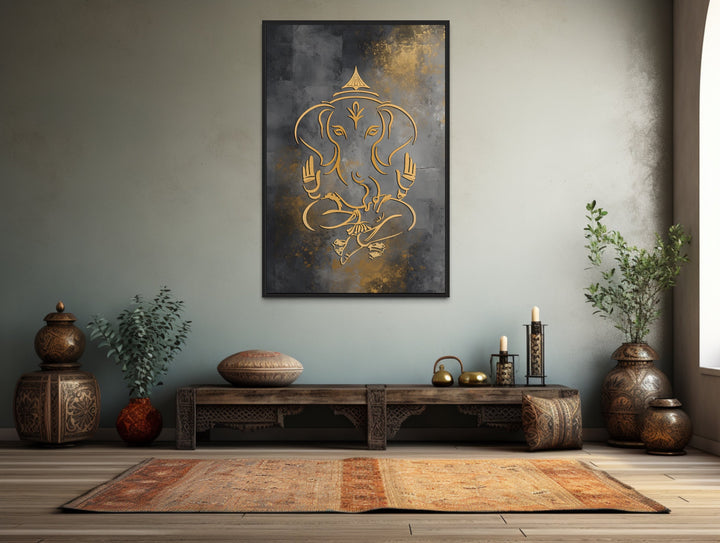 Minimalist Lord Ganesha framed canvas wall art with gold accents on a gray textured background.