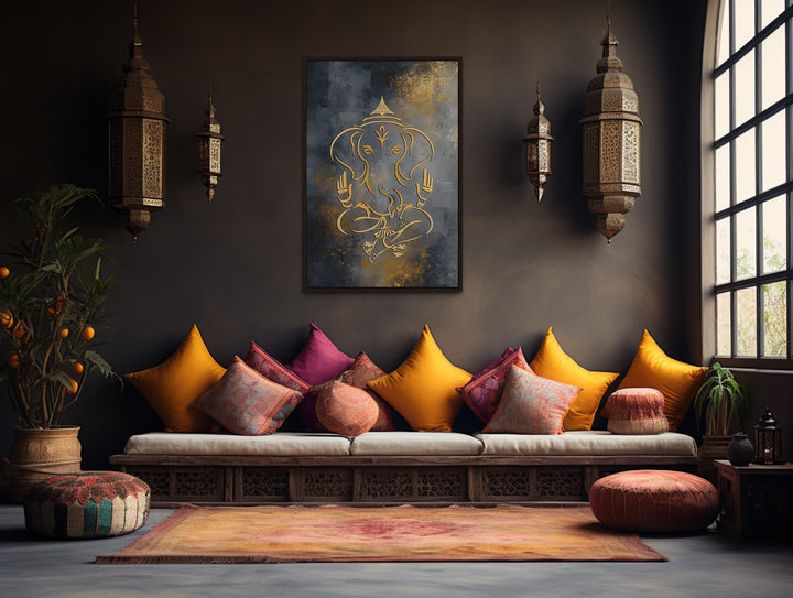 Minimalist gold Lord Ganesha line art on a dark framed canvas in a modern Indian-style living room.