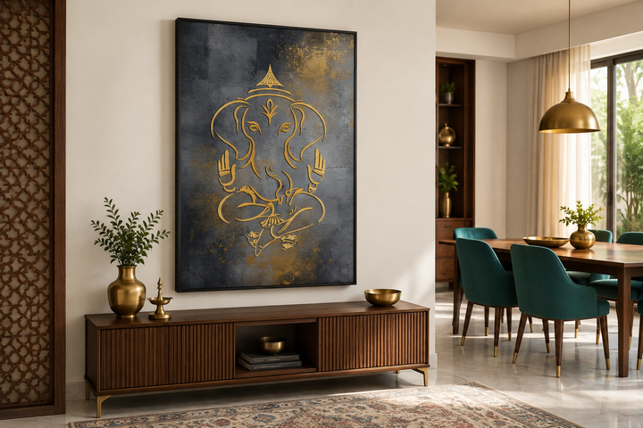 Modern gold Lord Ganesha line art on a dark gray framed canvas above a wooden console table.