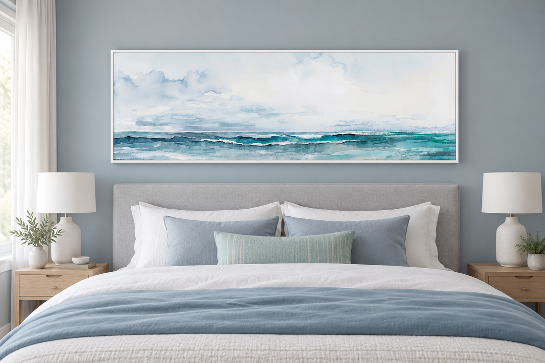 Minimalist ocean blue and gray horizontal framed canvas wall art hanging over a bed in a bedroom.