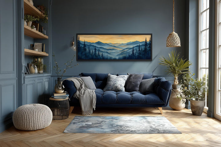 Misty mountain forest sunset long horizontal canvas wall art in a modern living room.