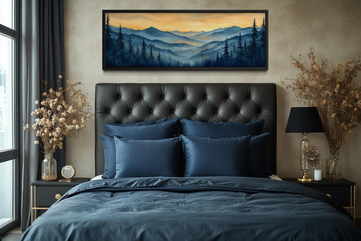 Misty mountain forest sunset long horizontal canvas wall art above a bed in a modern bedroom.