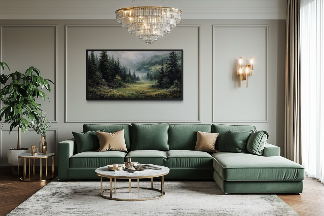 A panoramic canvas wall art of a misty mountain meadow and pine forest in a modern living room.