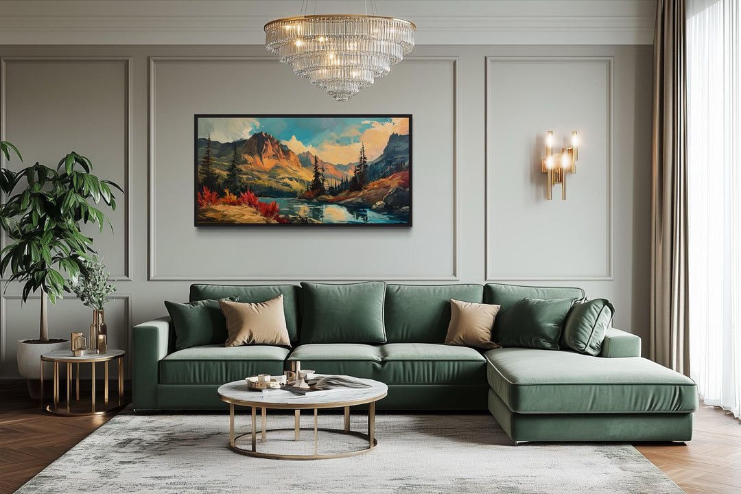 Modern abstract mountain lake sunset in autumn framed canvas wall art above a green sofa.