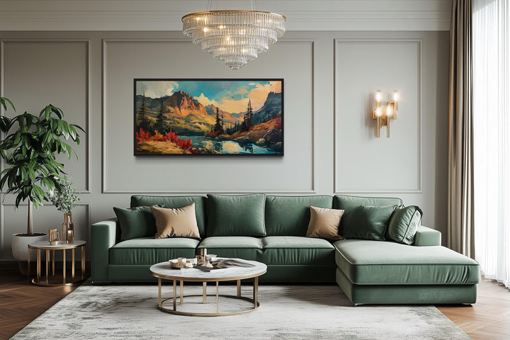 Modern abstract mountain lake sunset in autumn framed canvas wall art above a green sofa.