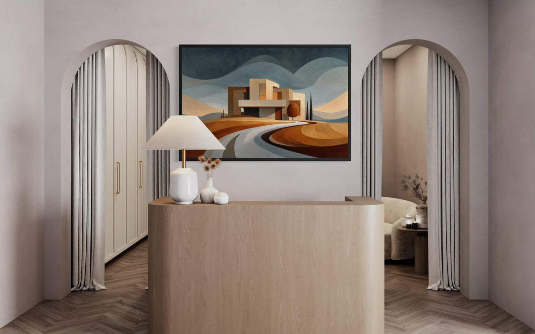 Modern architecture canvas print featuring a desert-style home above a curved road in an office.