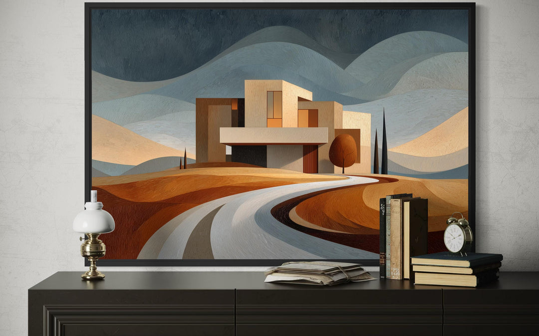 Modern architecture canvas print featuring a desert-style home and winding road in a black frame.
