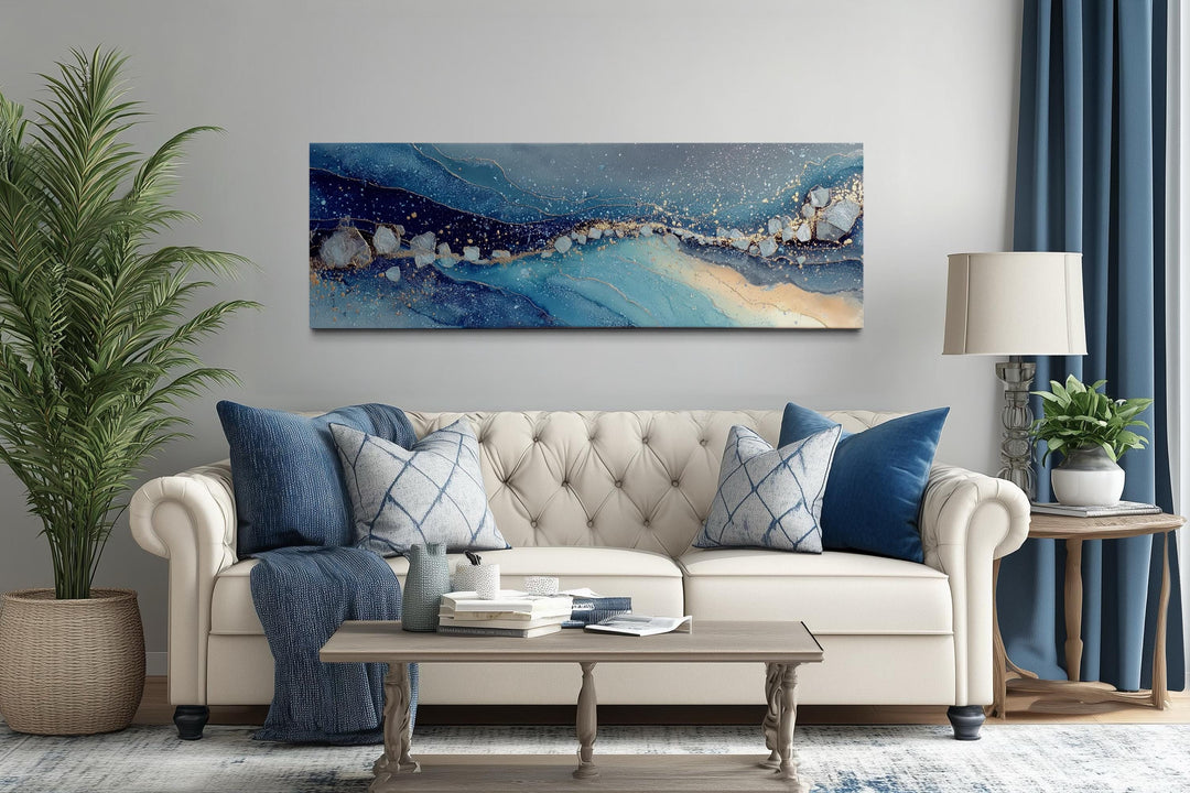Modern long horizontal canvas art featuring abstract blue and navy waves with gold accents.