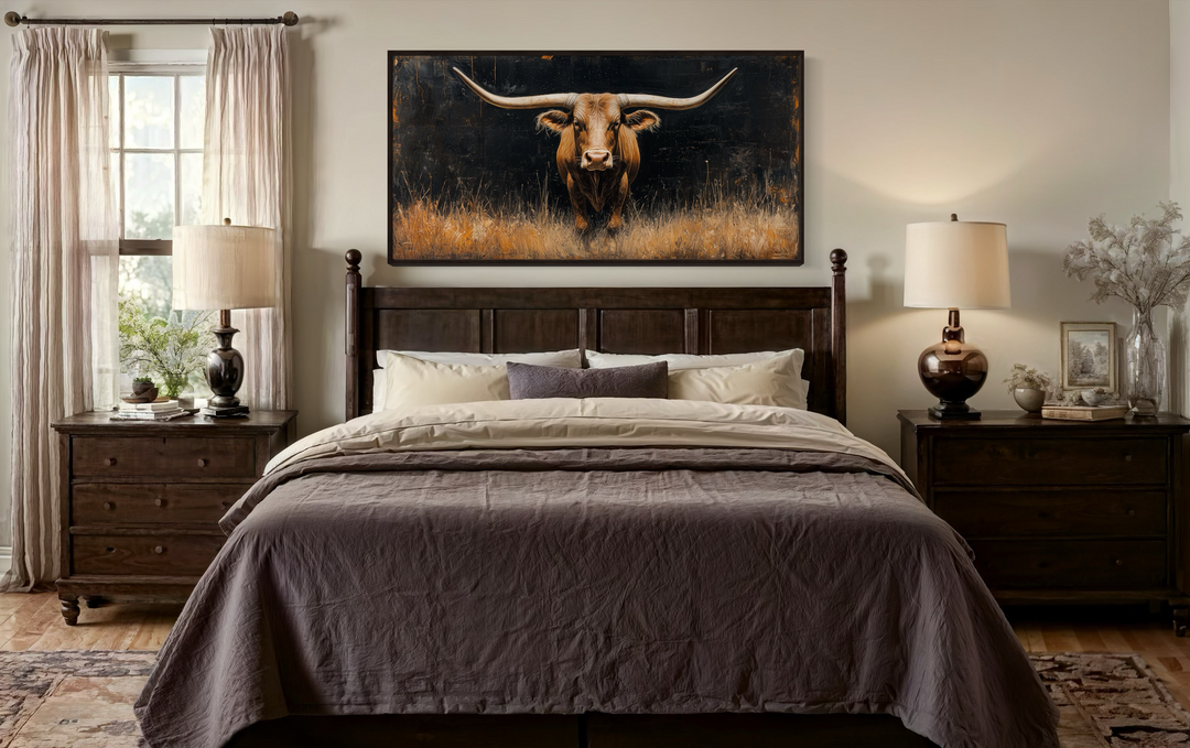 Modern Texas Longhorn steer framed canvas wall art hanging above a dark wood bed in a bedroom.