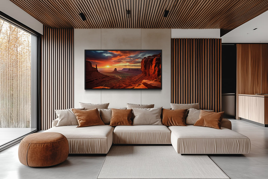 Monument Valley sunset framed canvas wall art hanging in a modern living room with a beige sofa.