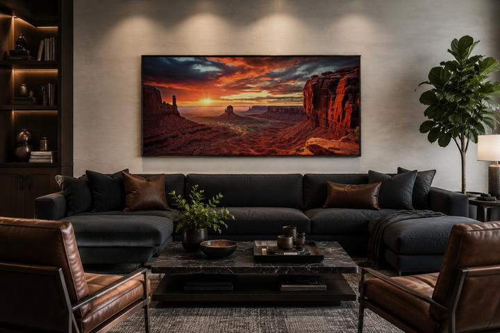 Monument Valley sunset framed canvas wall art above a dark sofa in a modern living room.