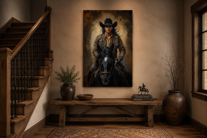 Moody cowboy portrait on canvas, riding a black horse in warm golden light, western wall art.