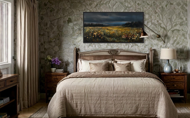 Moody Wildflowers Meadow At Night Canvas Wall Art hanging above a bed in a rustic stone bedroom.