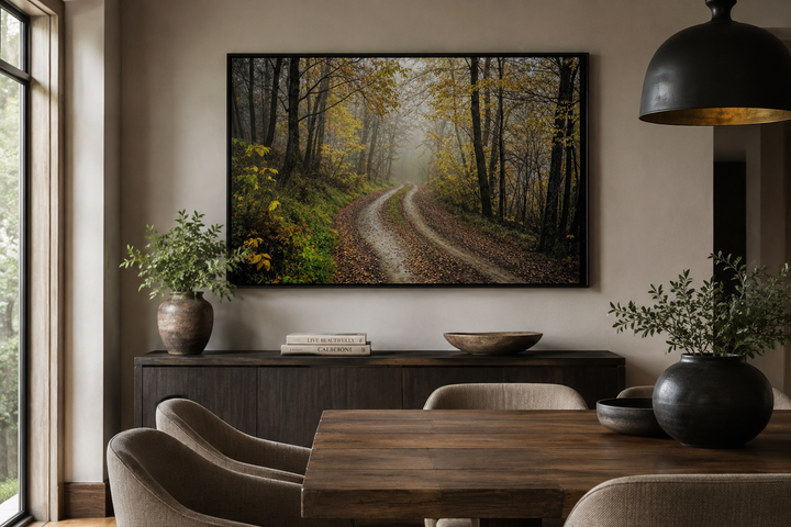 Moody Foggy Autumn Forest Framed Canvas Wall Art hanging above a sideboard in a dining room.