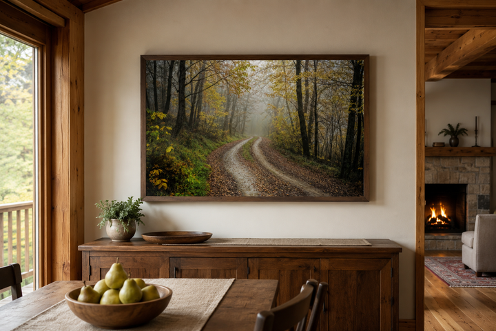 Moody Foggy Autumn Forest framed canvas wall art hanging above a wooden sideboard in a rustic room.