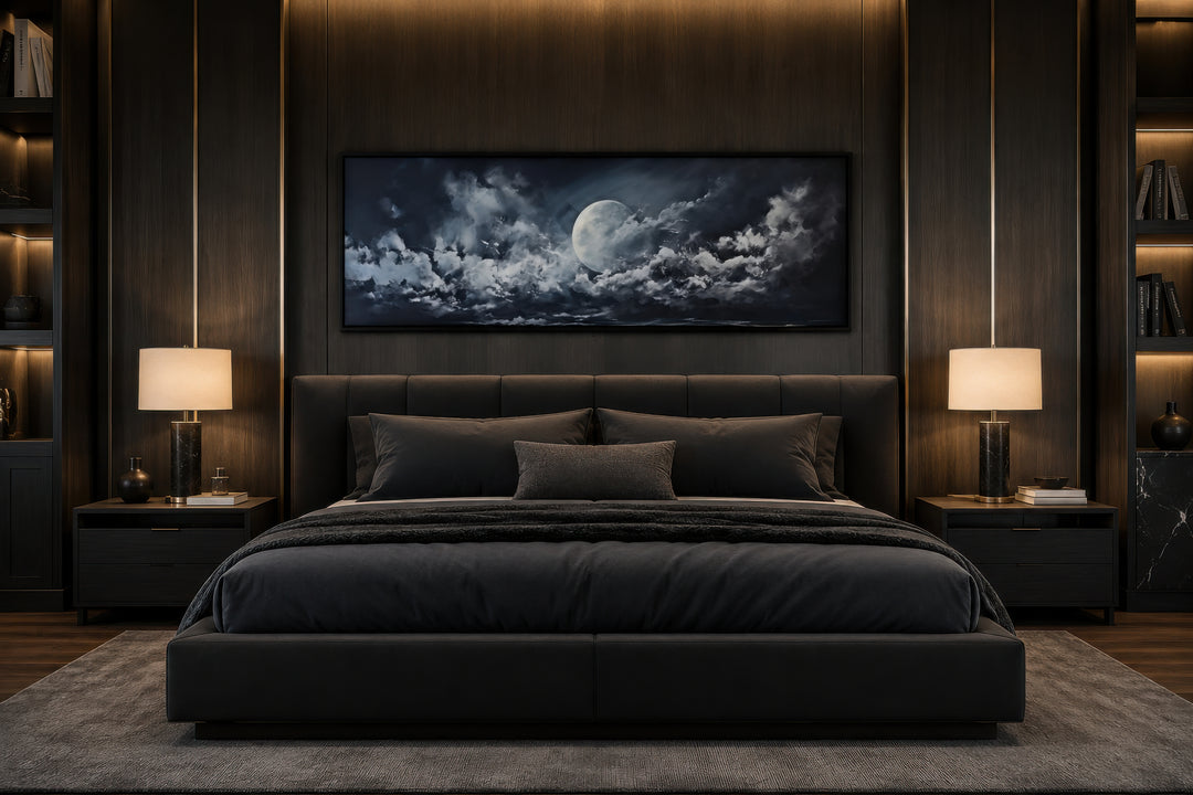 Horizontal framed canvas wall art of a full moon and dramatic clouds above a modern bed.