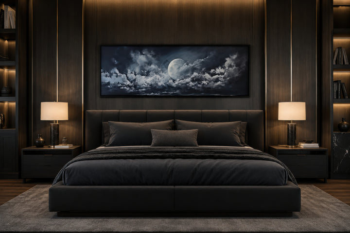 Horizontal framed canvas wall art of a full moon and dramatic clouds above a modern bed.