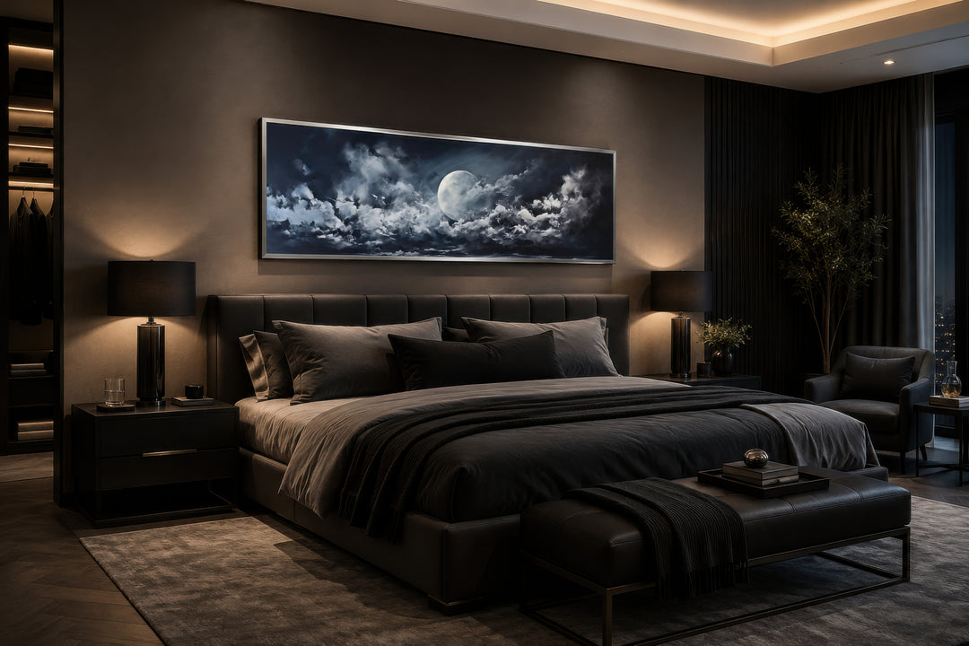 Moon and cloudy sky horizontal framed canvas wall art hanging above a bed in a dark modern bedroom.