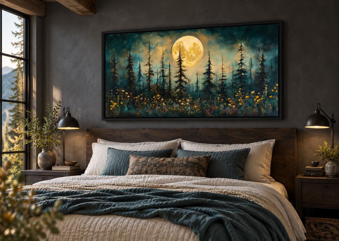 Mystical moonlit forest and wildflowers painting in a black frame above a rustic wooden bed.