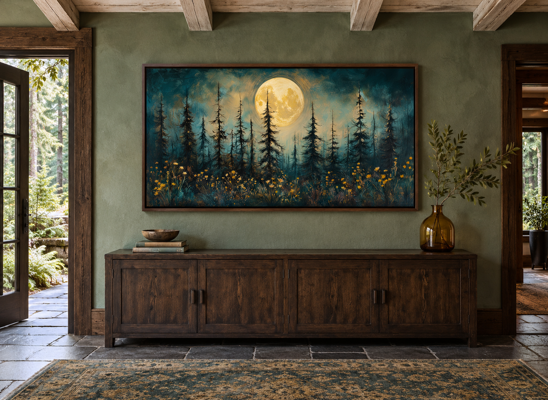 Mystical moonlit forest and wildflowers painting in a rustic frame above a dark wood sideboard.