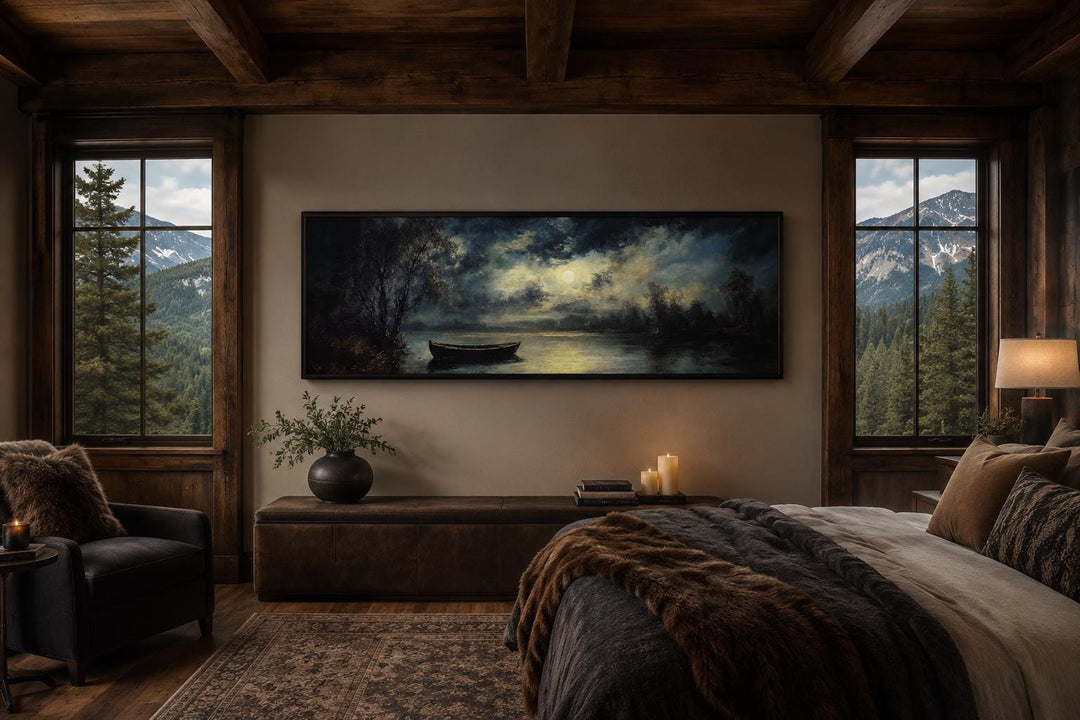 Moonlit rowboat and lake landscape long narrow canvas wall art hanging in a rustic cabin bedroom.