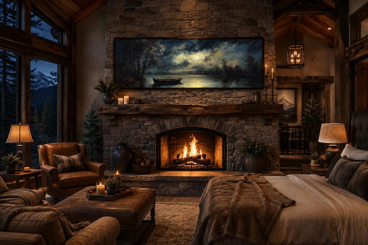 Moonlit rowboat and lake landscape long narrow canvas wall art above a stone fireplace in a cabin.