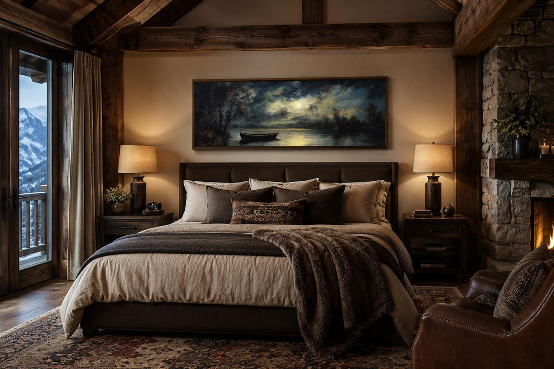 Moonlit rowboat and lake landscape long narrow canvas wall art above a bed in a rustic cabin.