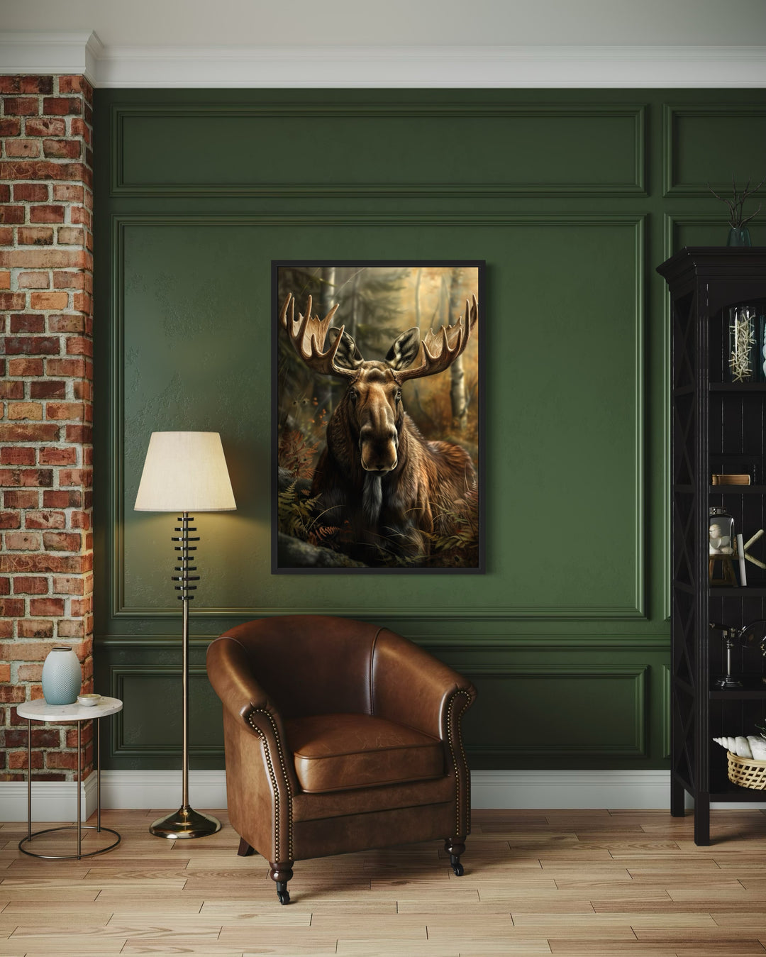 Moose In The Forest Framed Canvas Wall Art hanging in a rustic living room with a leather armchair.