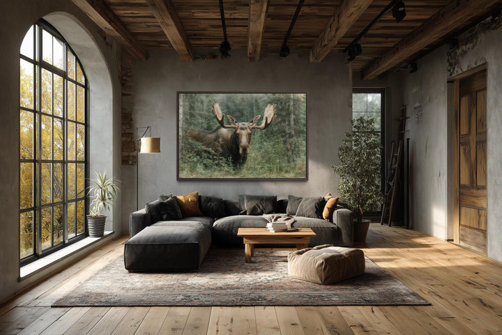Moose in the forest wall art featuring a rustic wildlife painting on canvas in a lodge-style room.