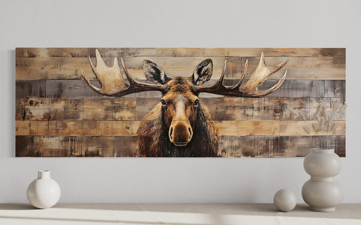 Rustic horizontal canvas wall art of a moose painted on a textured wood-plank background.