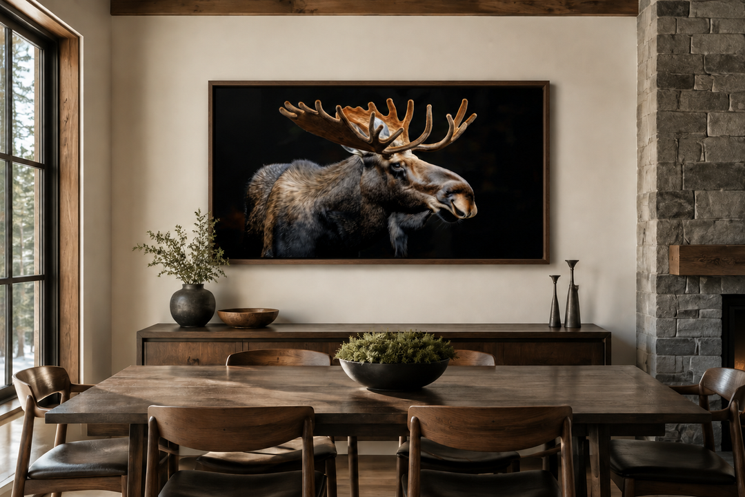 Extra large framed moose canvas wall art in a rustic dining room with a wooden table and chairs.